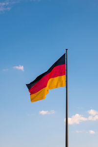 Low angle view of flag against sky