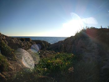 Panoramic view of beach against clear sky