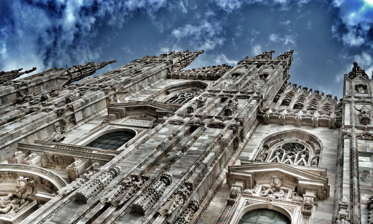 architecture, built structure, building exterior, low angle view, sky, place of worship, religion, history, cloud - sky, spirituality, church, cathedral, travel destinations, famous place, art and craft, travel, tourism, ornate