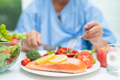 Midsection of man having food