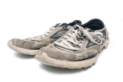 Close-up of shoes against white background