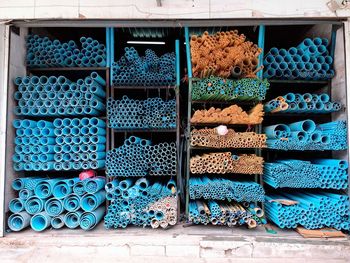 Stack of firewood for sale at market stall