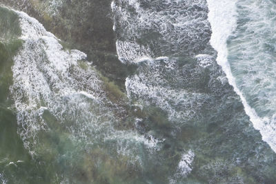 Full frame shot of water flowing through rocks