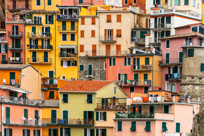 Colorful buildings and old facade with windows in small village manarola cinque terre in liguria