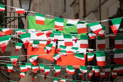 Multi colored flags hanging on clothesline