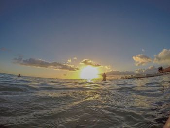 Scenic view of beach against sky during sunset