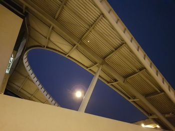 Low angle view of illuminated lights against sky at night