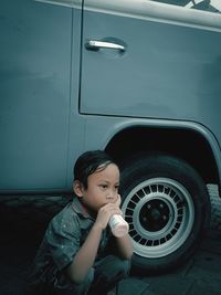 Portrait of cute boy in car