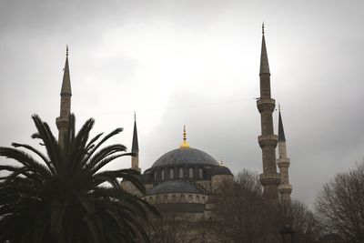 Low angle view of mosque against sky