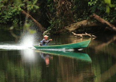 Man sailing in lake