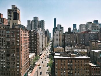 High angle view of buildings in city against sky