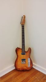 Close-up of guitar on table at home