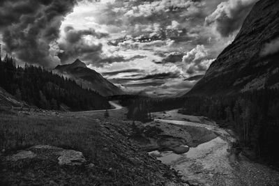 Scenic view of mountains against cloudy sky