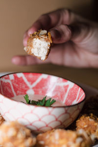 Close-up of hand holding ice cream