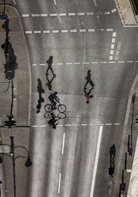 High angle view of people walking on road