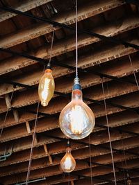 Low angle view of light bulb hanging