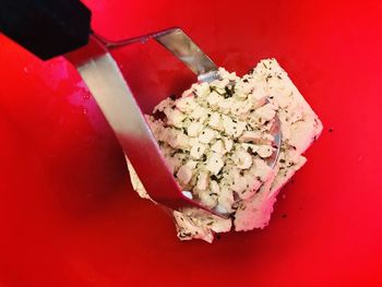 High angle view of ice cream on red table