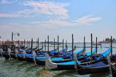 Boats moored in sea