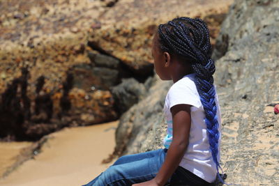 Side view of girl with braided hair