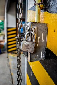 Close-up of padlock on metal 