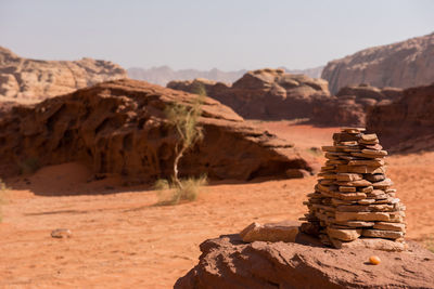 Close-up of rocks stacked at desert