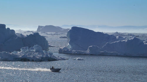 Scenic view of sea against sky during winter