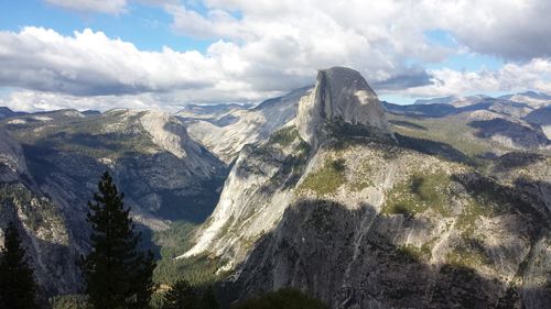 Scenic view of mountains against cloudy sky