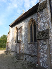 Low angle view of old building against sky