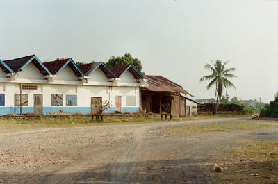 Houses on beach against clear sky