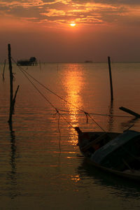 Scenic view of sea against orange sky