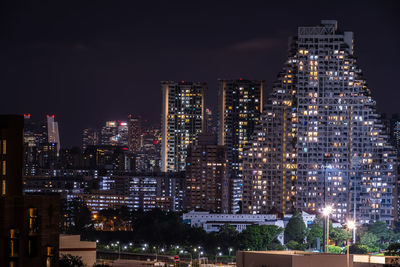 Illuminated buildings in city at night
