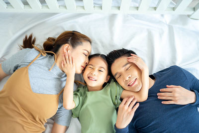 High angle view of people on bed