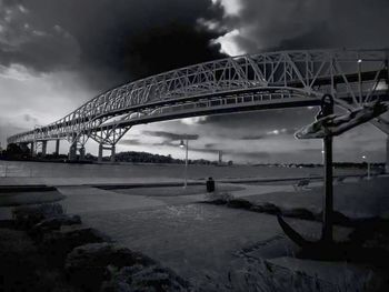 View of bridge against cloudy sky