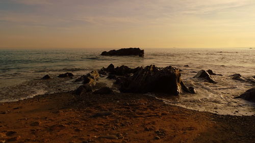 Scenic view of sea against sky during sunset
