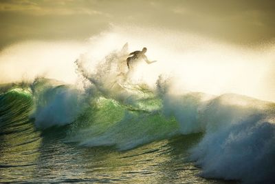 View of man splashing water