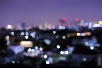 Defocused image of illuminated lights at night