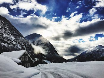 Scenic view of snow covered mountains against sky