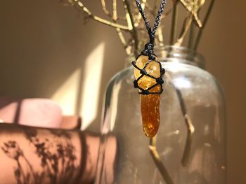 Close-up of pendant hanging at home