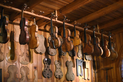 Close-up of violins on wall