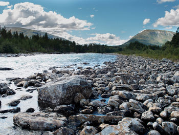 Scenic view of river and mountains