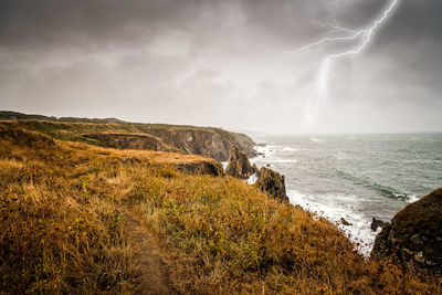 Lightning bolt strike from a thunderstorm near the cliffs of pointe saint mathieu, brittany, france