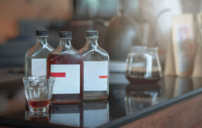 Close-up of wine glasses on table