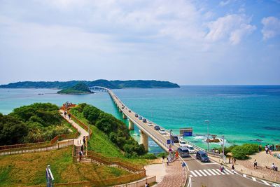 High angle view of road by sea against sky