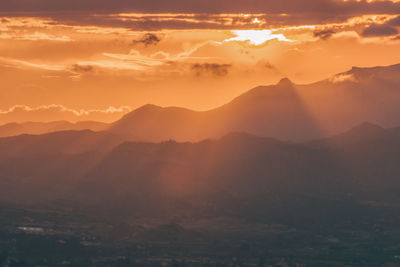 Beautiful sunset in costa blanca, spain. dark silhouette of mountains on sunset background