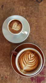 Directly above shot of coffee cups on table