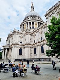 Group of people on street at st paul's cathedral in london