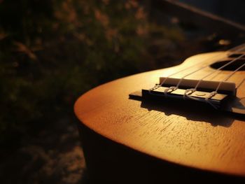 Close-up of guitar on table