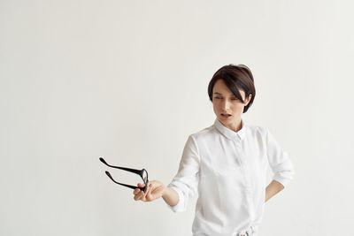 Portrait of a beautiful young woman over white background