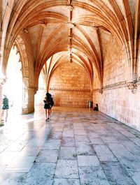 Woman walking in corridor