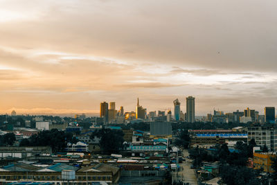 High angle view of buildings against sky during sunset